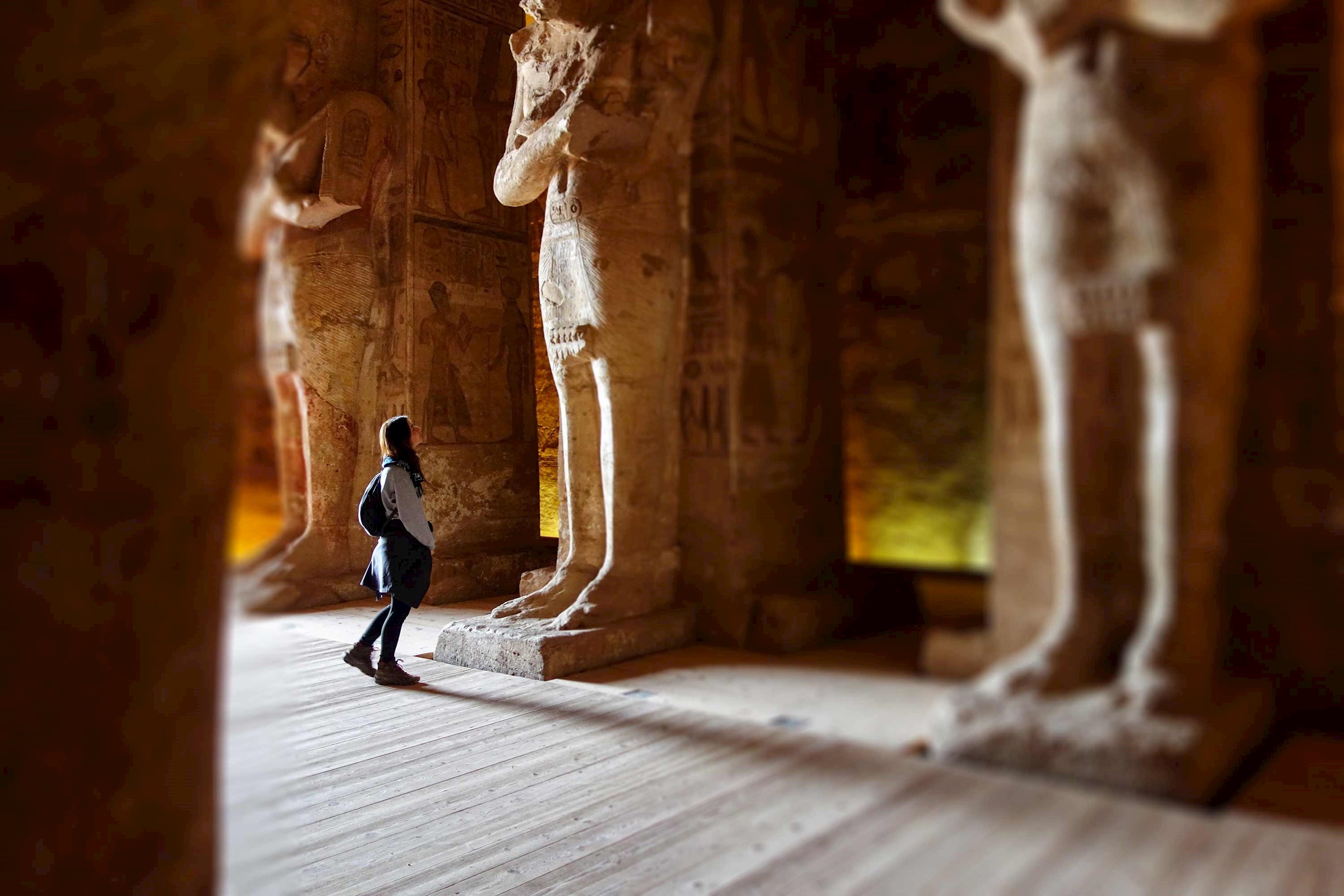 Statue lined temple interior with visitor, Abu Simbel, Egypt
