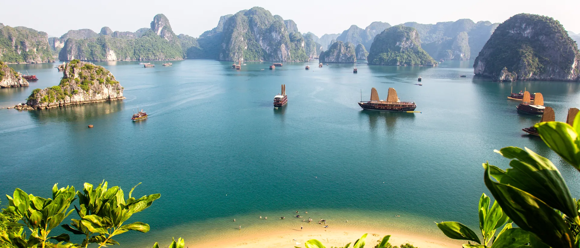 Traditional boats sailing through ha long bay in Vietnam