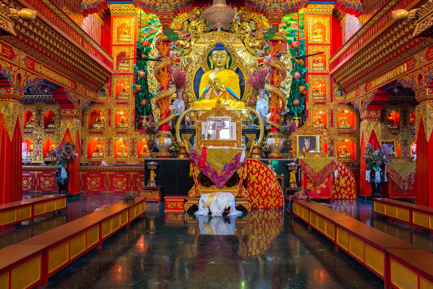 Representation of a Hindu god inside a colourful temple Sarnath India