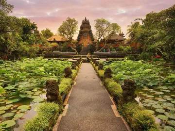 Temple under warm golden light at sunset in Ubud, Indonesia