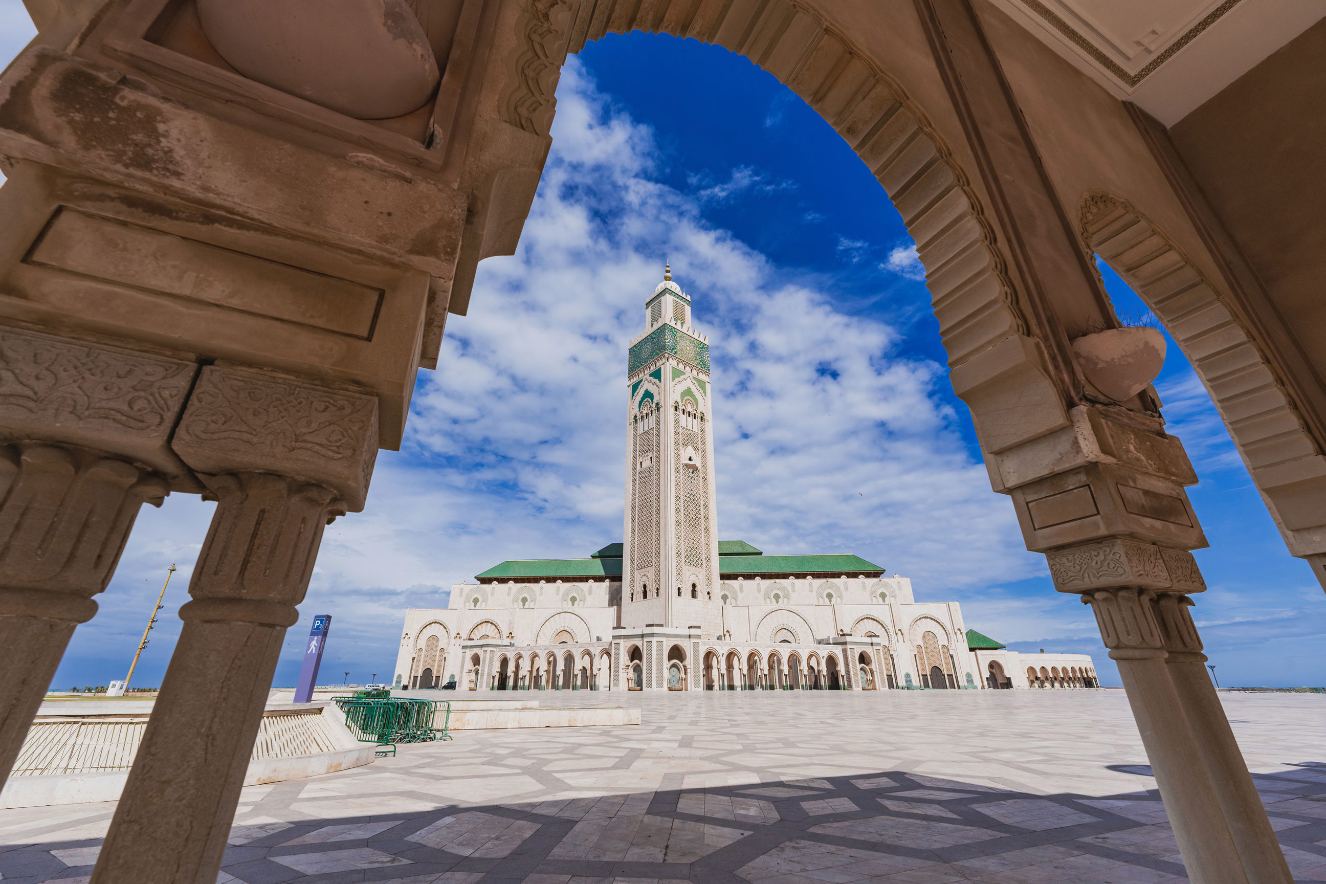 Hassan II Mosque framed by ornate arch in Casablanca, Morocco