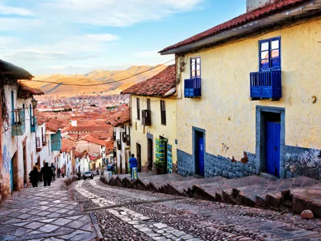 Historic architecture of Cusco along steep street northwest of Plaza de Armas, Peru