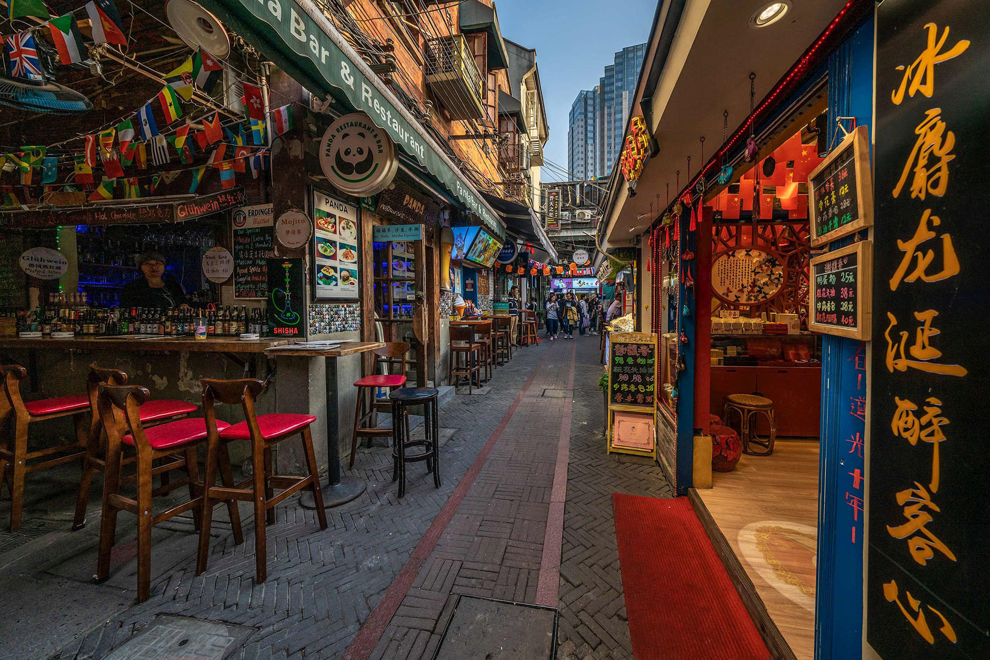 Narrow alley in Shanghai’s Tianzifang lined with bars and restaurants