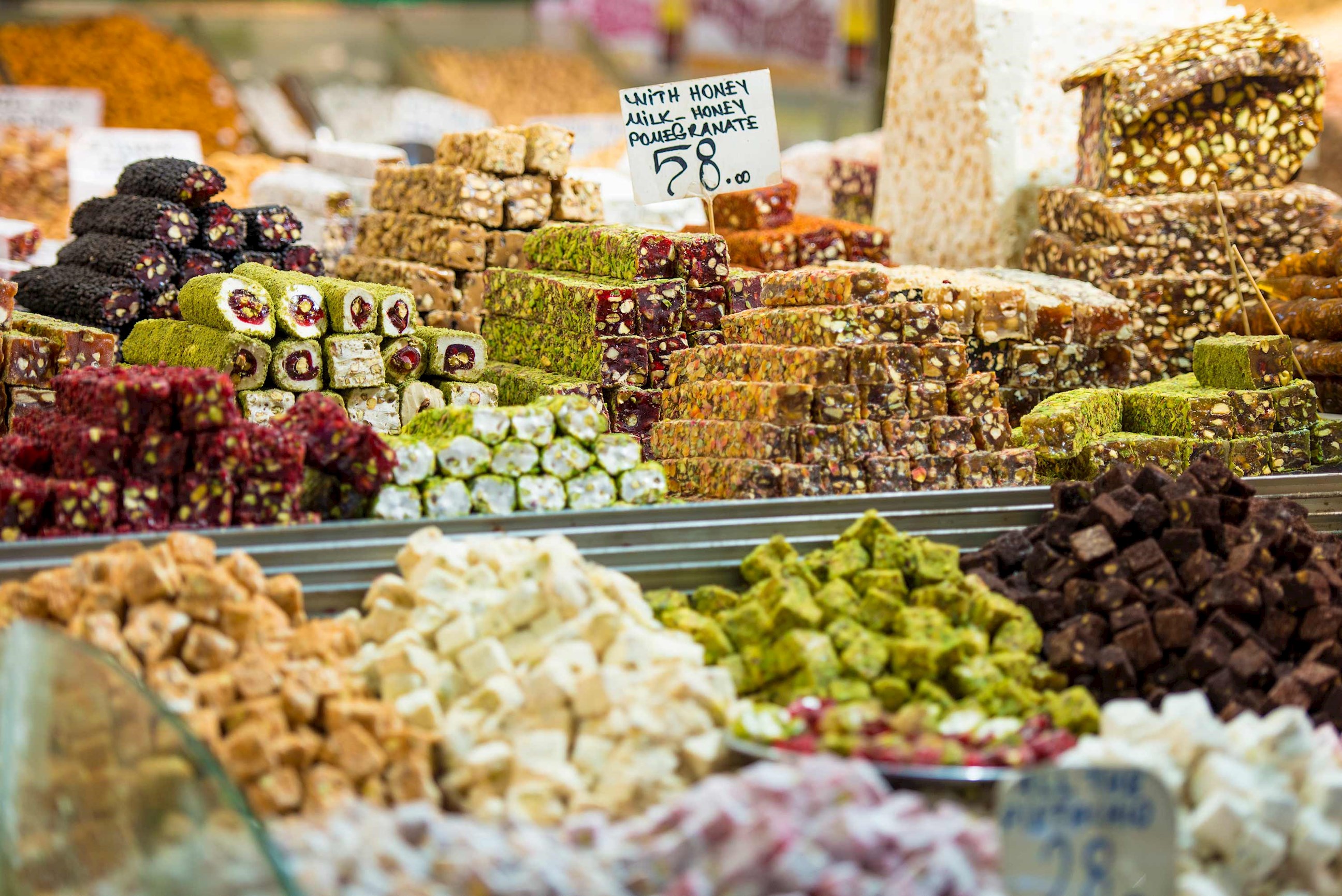 Display of assorted Turkish delights and nut-filled sweets in market