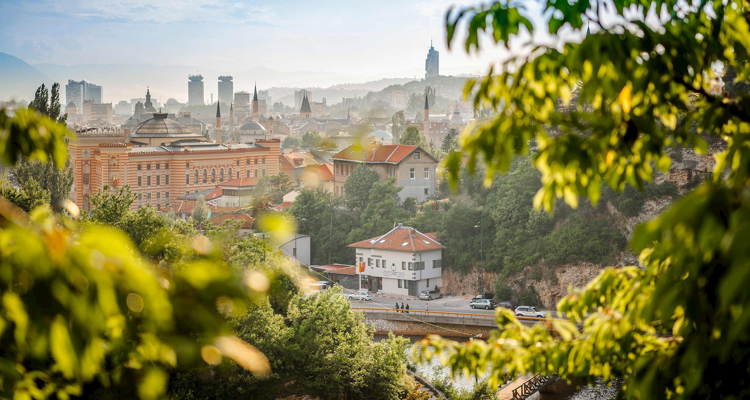 A scenic skyline view with buildings and greenery in Sarajevo, Bosnia and Herzegovina