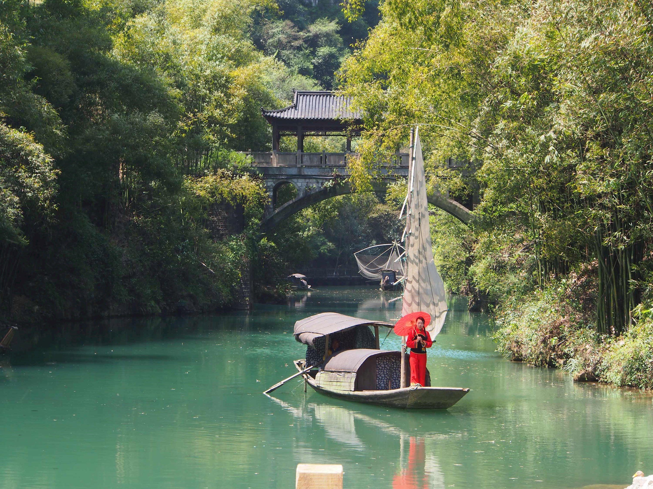 Traditional Chinese boat sailing on river near Three Gorges Dam area