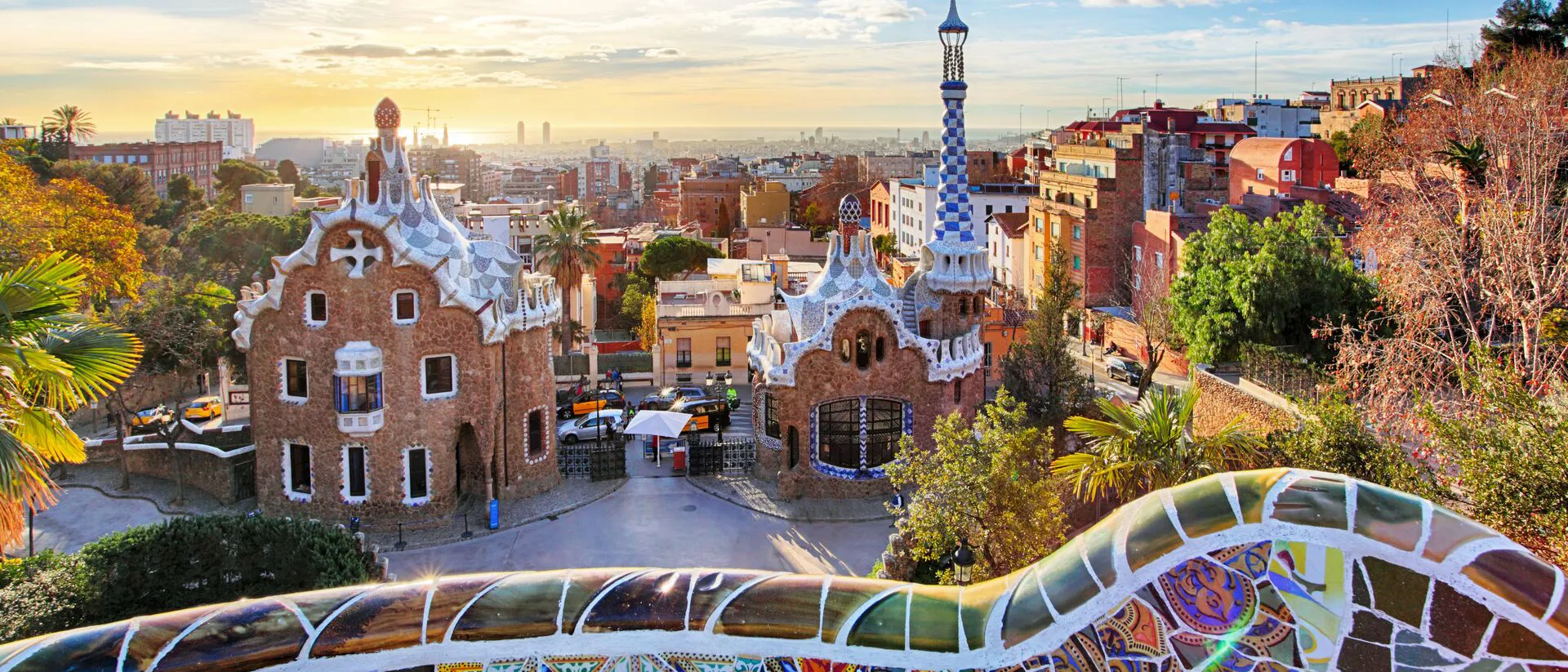 Aerial shot of Park Guell in Barcelona, Spain with colourful wall in foreground