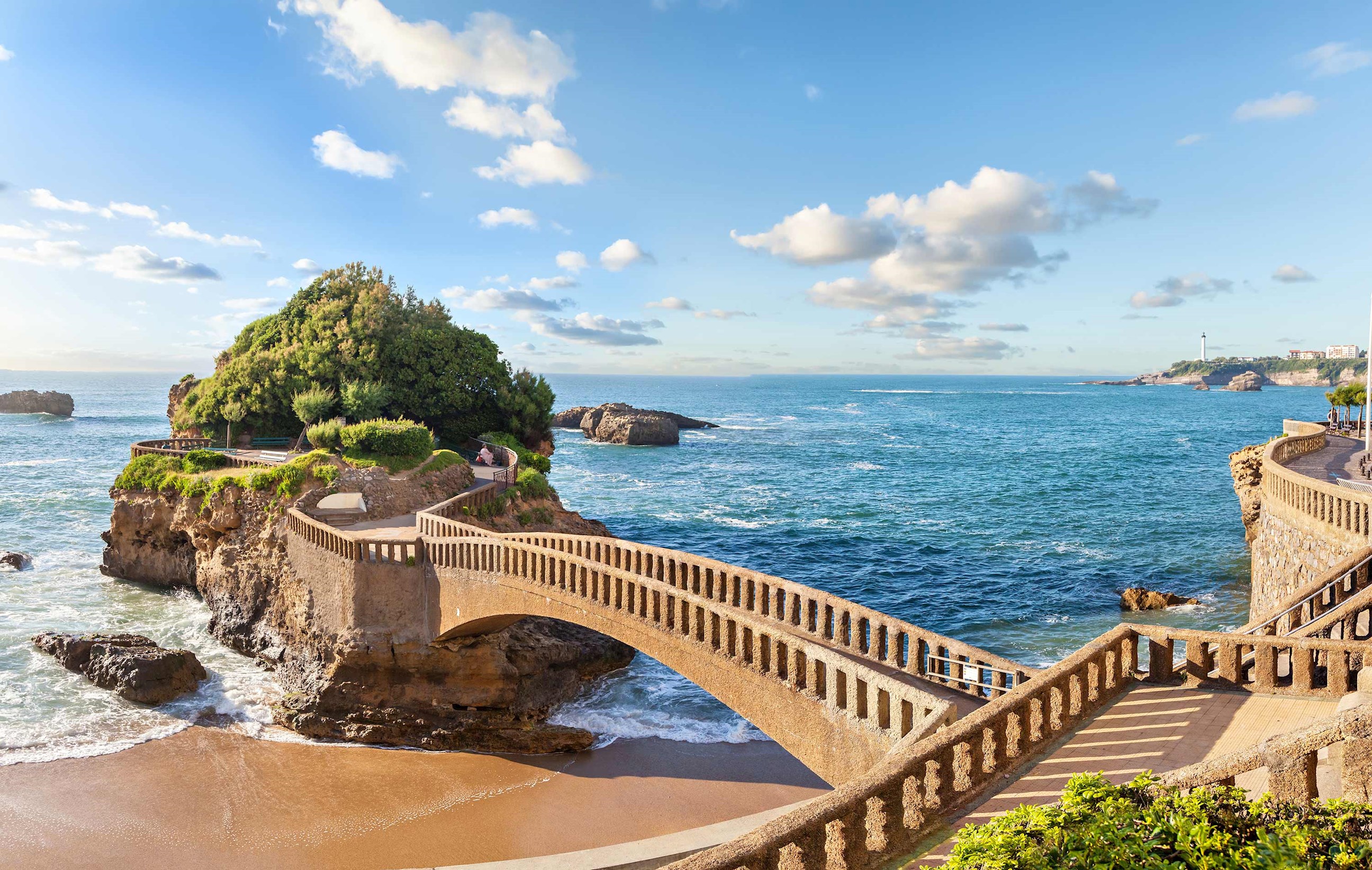Panoramic view of stone bridge and coastline in Biarritz, France