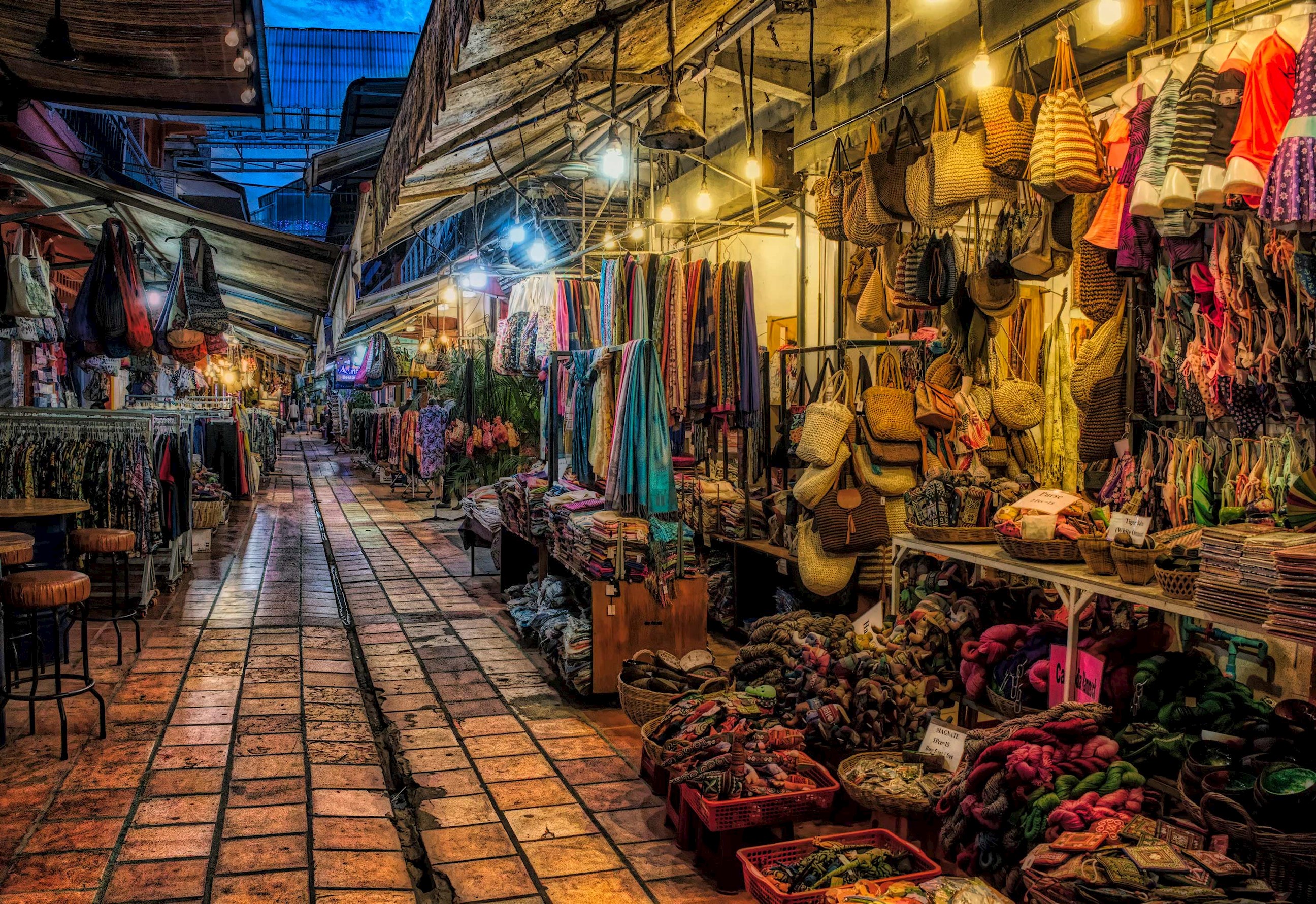 Colourful night market with stalls selling bags, scarves and crafts in Siem Reap, Cambodia