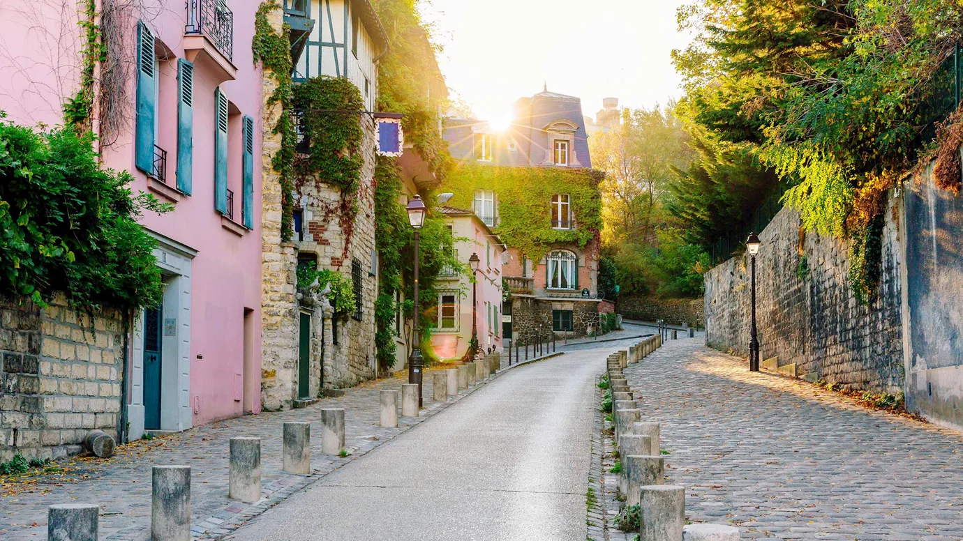 External view of a cobblestone street on a sunny day in Paris, France