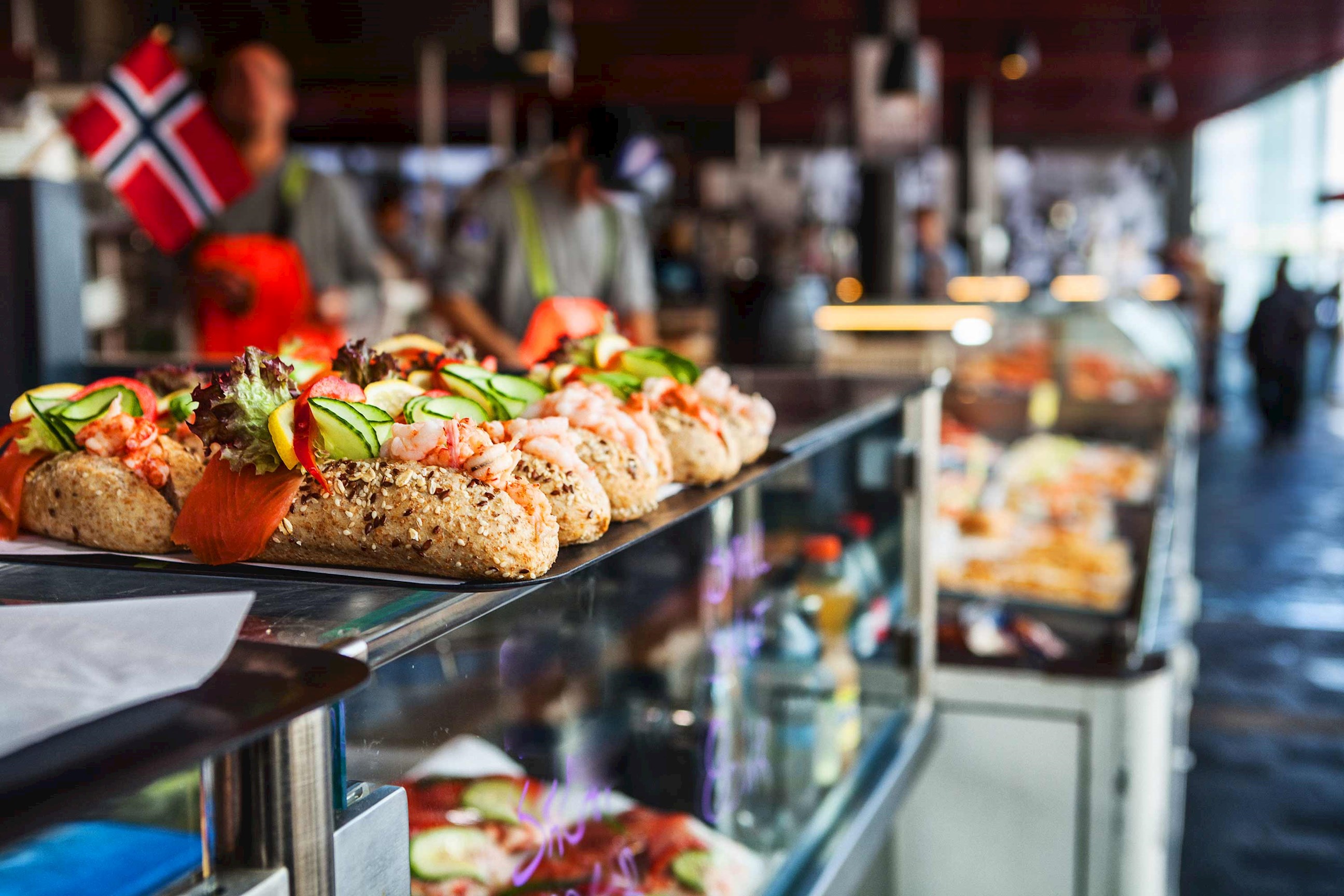 Display of open sandwiches with seafood and vegetables in market in Bergen