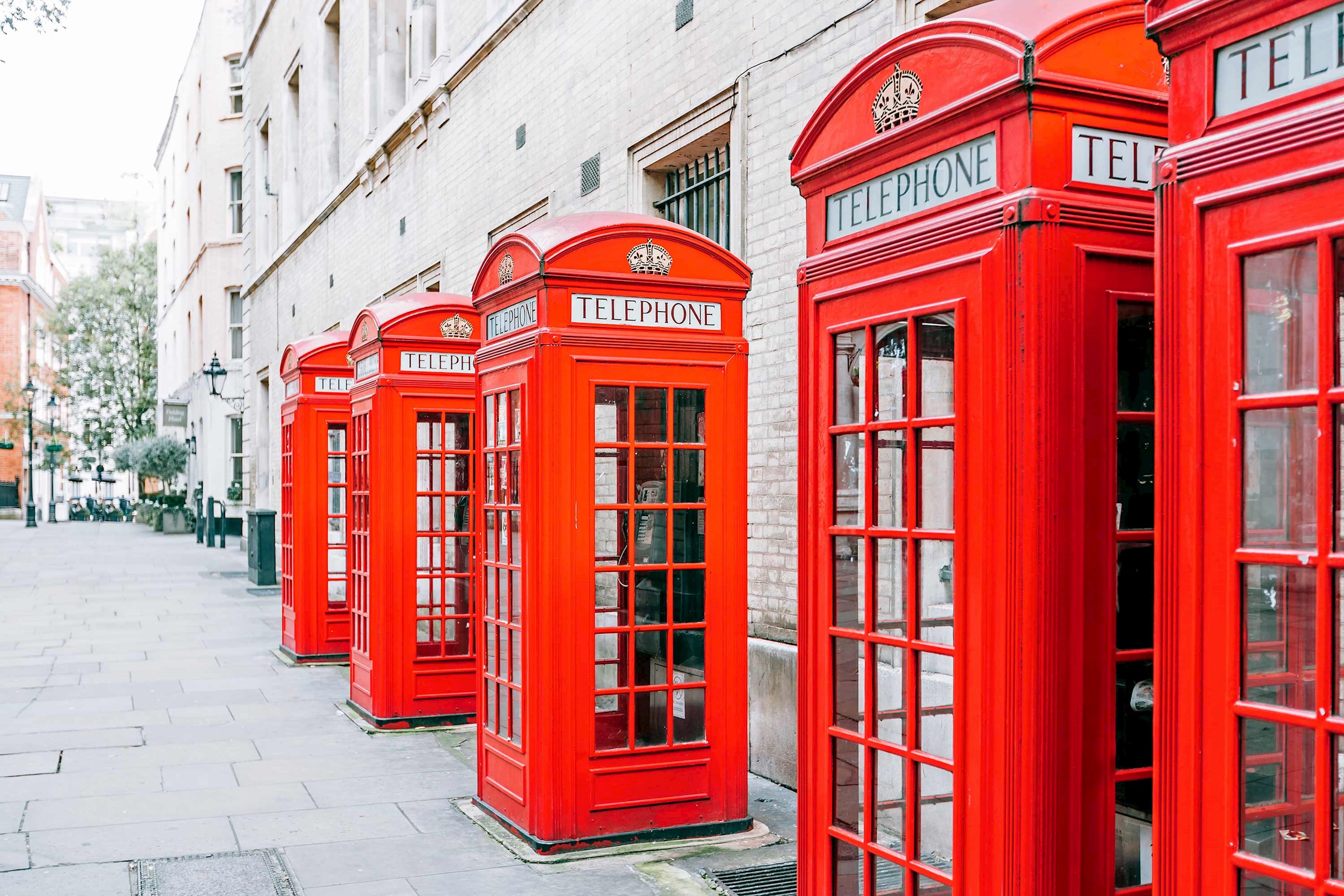 A row of classic telephone boxes in London, England