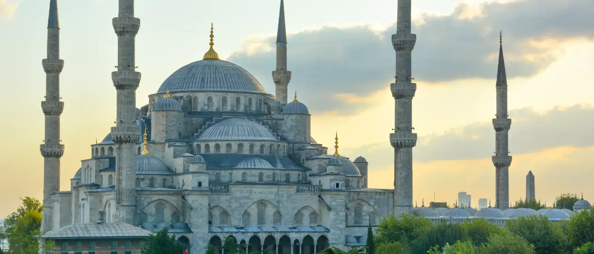 Hagia Sophia in Turkey surrounded by green trees. Beautiful view on tour in Turkey.