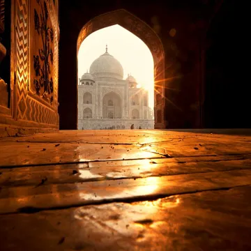 A view through a door of the Taj Mahal at sunrise, Agra, India