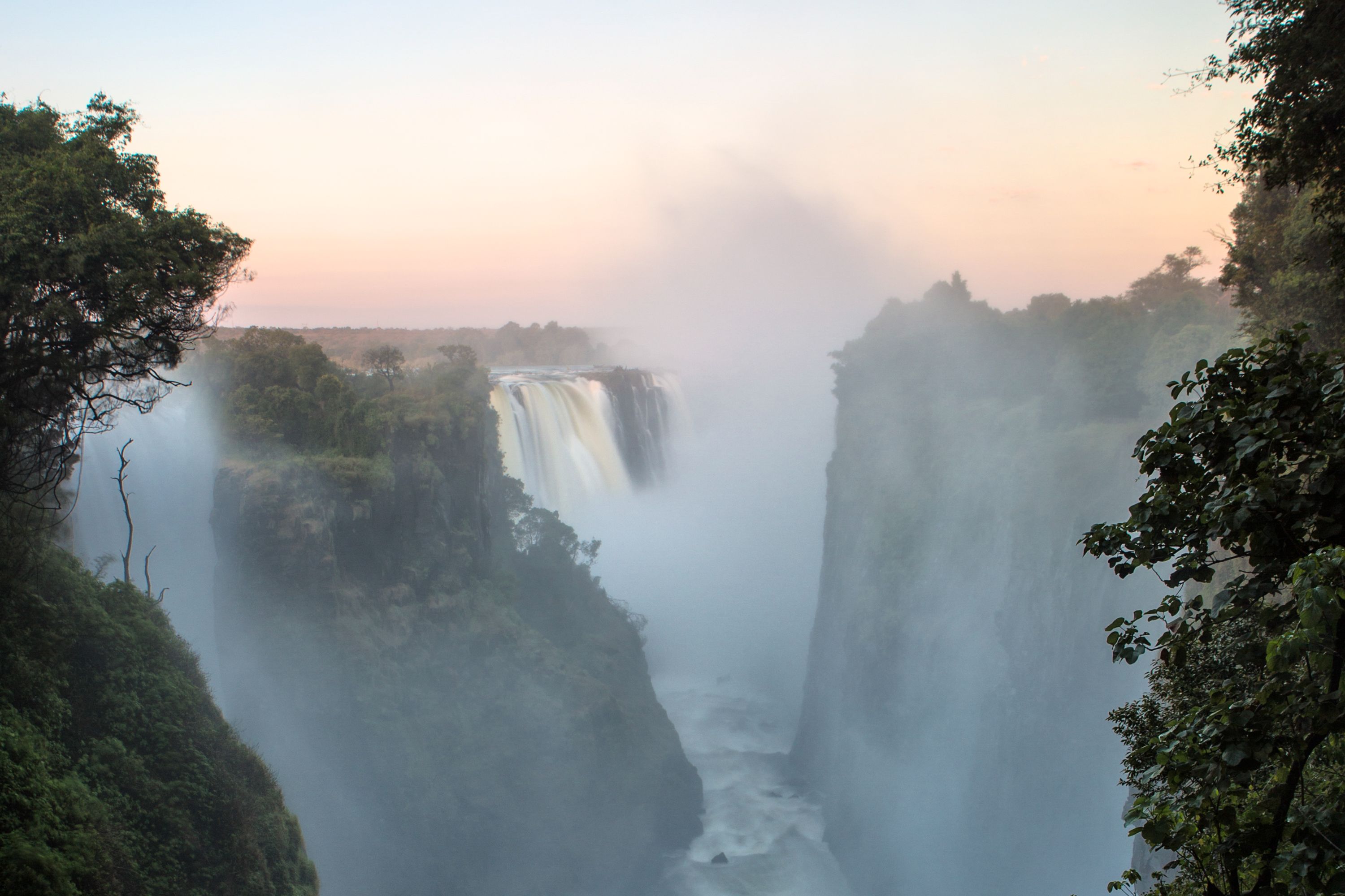 Victoria Falls, Zimbabwe producing a lot of spray rising up into the sky
