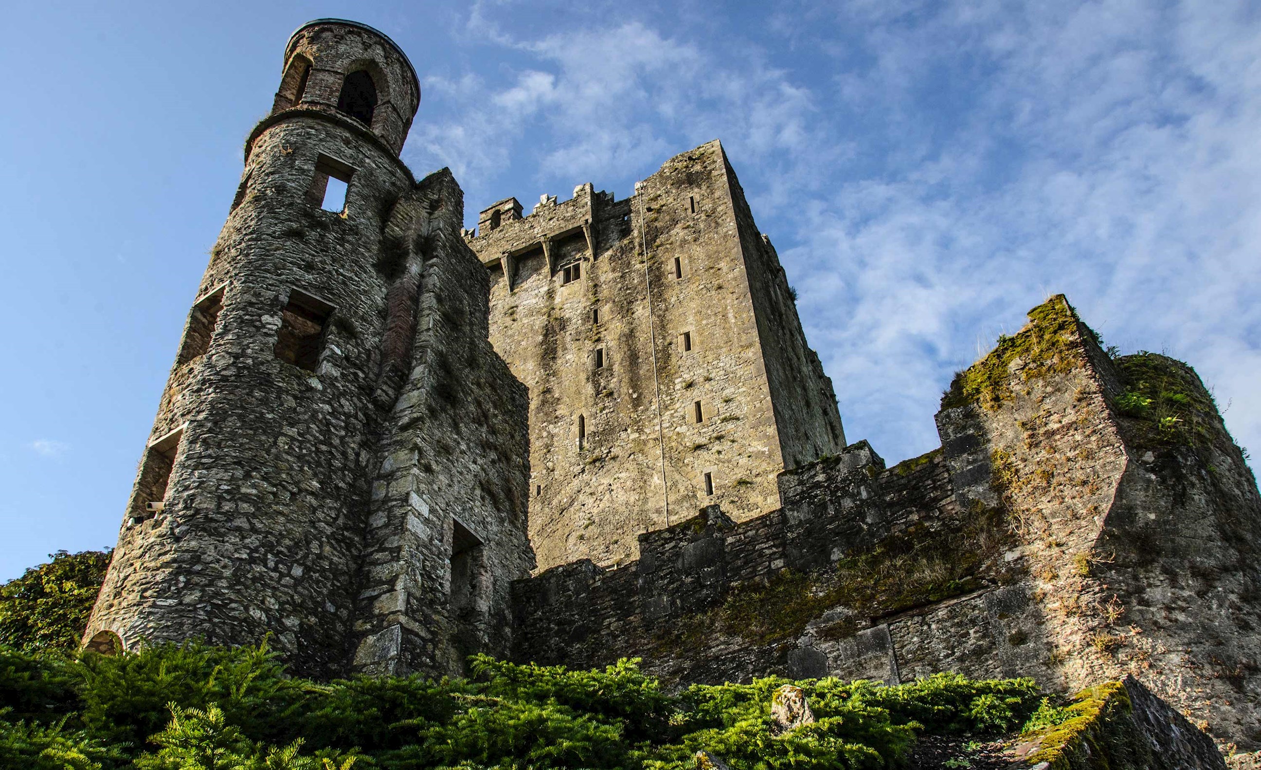 A low angle shot of Blarney Castle against clear skies in Cork, Ireland