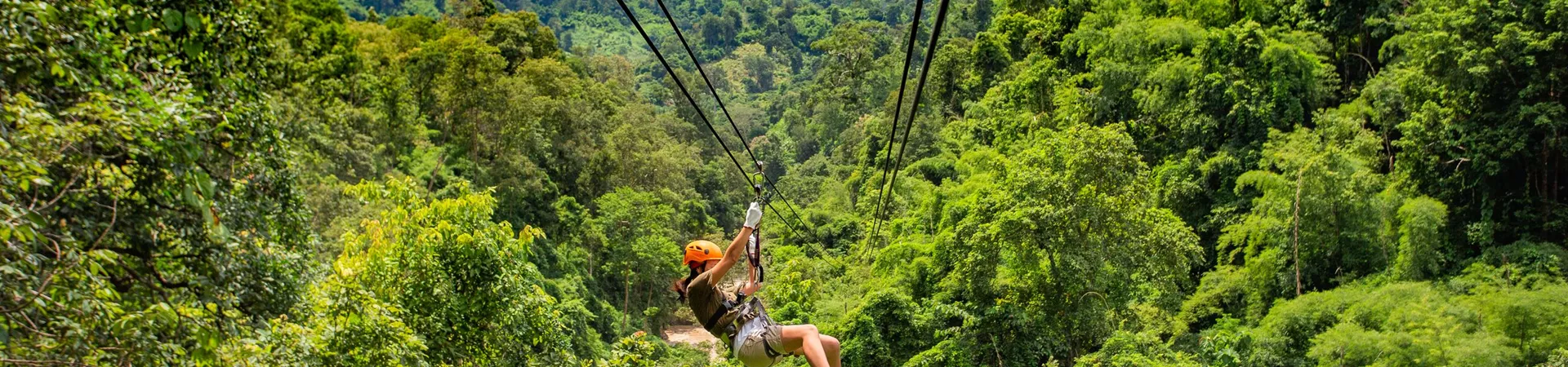 Woman on a Zipline Adventure through the jungle in Chiang Mai, Thailand