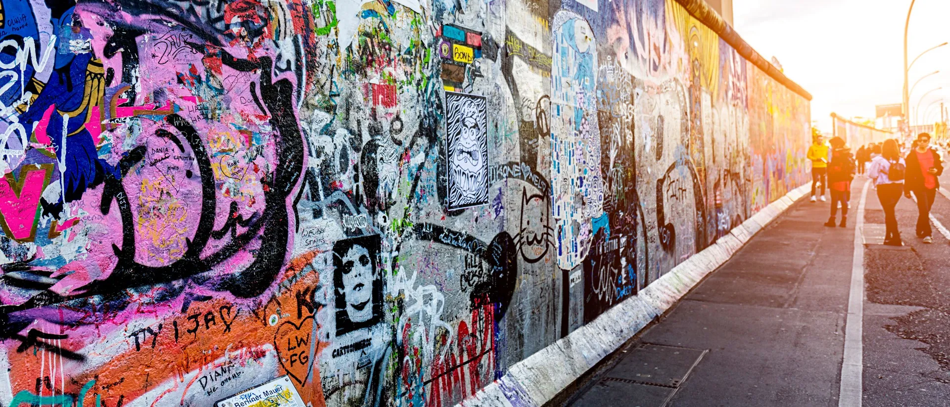 Graffiti Paintings On The East Side Gallery Wall Berliner Mauer Of Berlin Germany