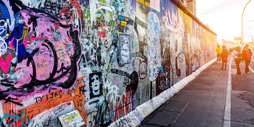 Graffiti Paintings On The East Side Gallery Wall Berliner Mauer Of Berlin Germany