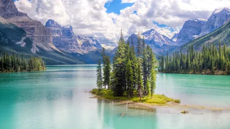 Spirit Island With Mountains In The Background in Maligne Lake in Jasper National Park, Canada