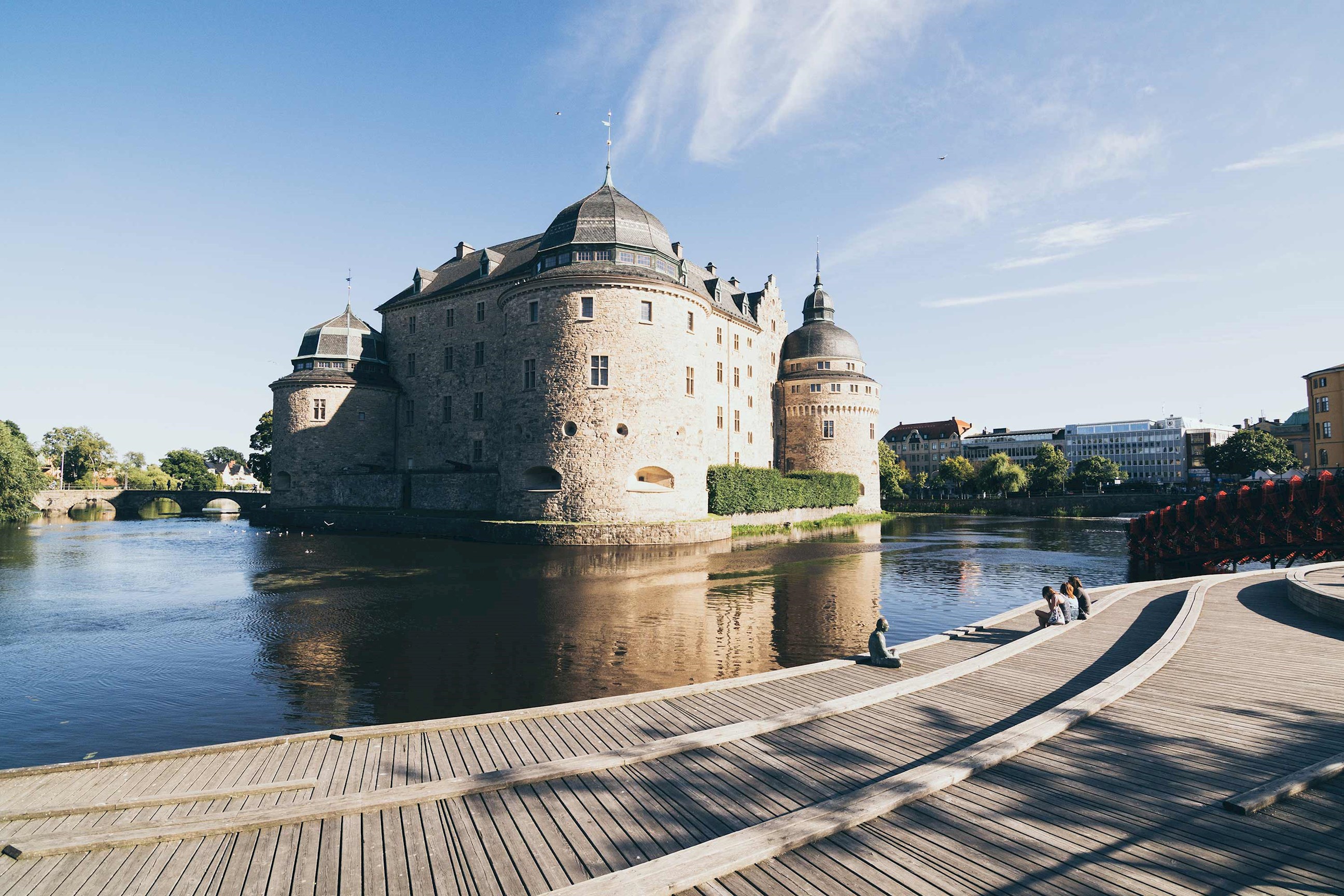 Large stone castle surrounded by water in Örebro, Sweden