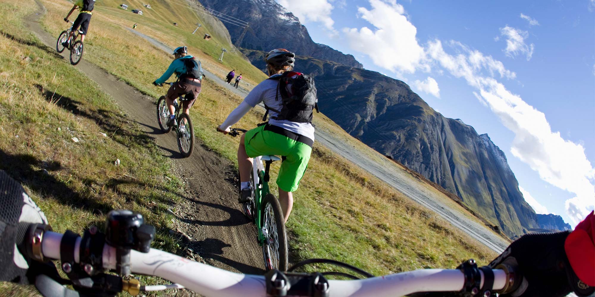 POV of person on a mountain bike, behind his fellow cyclists