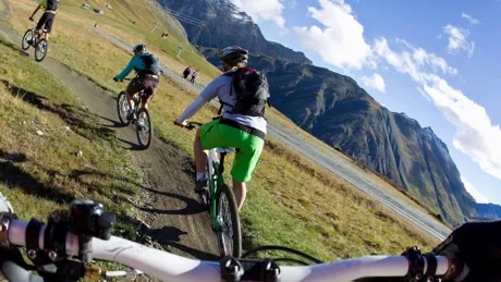 POV of person on a mountain bike, behind his fellow cyclists