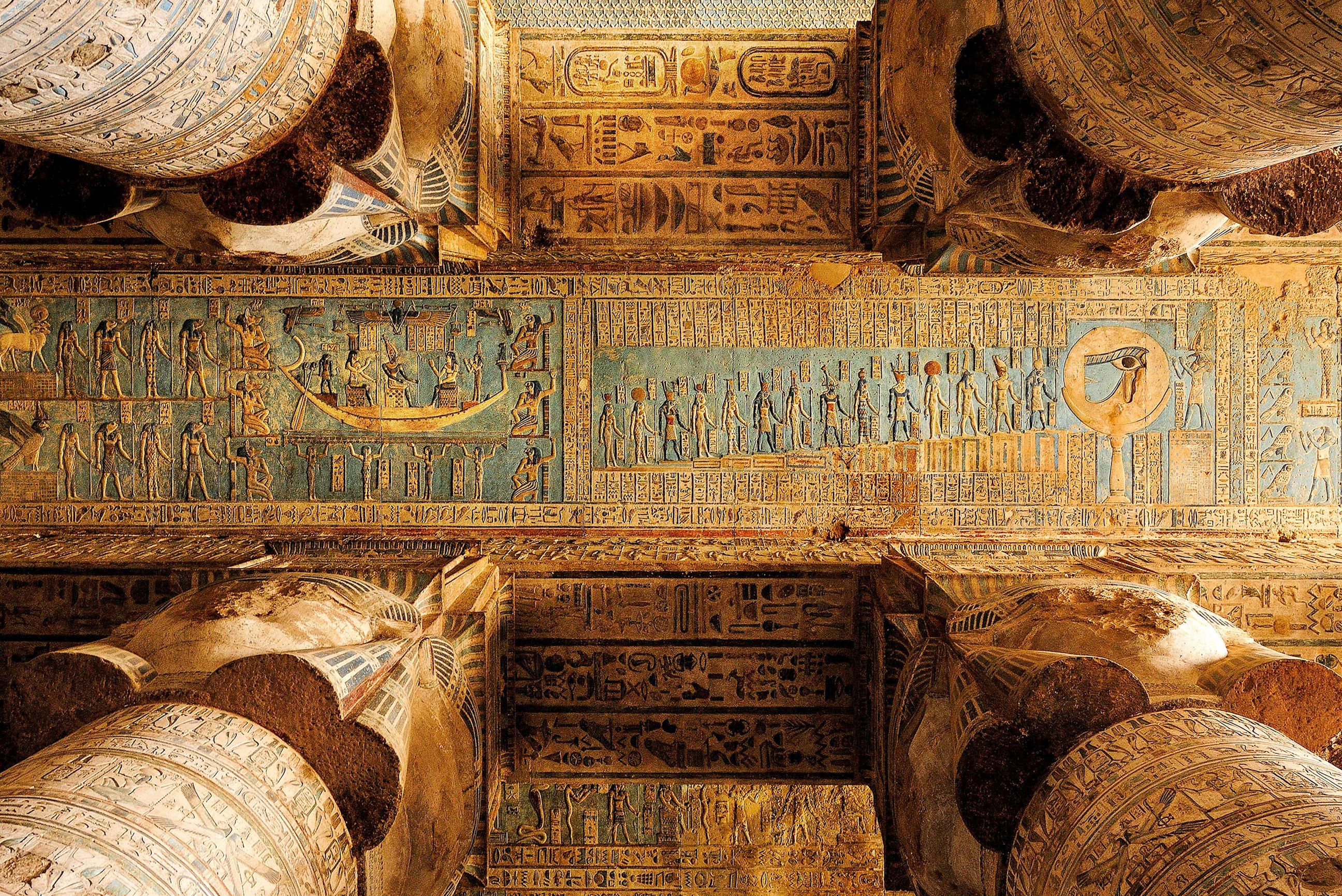 A view of the painted ceiling and columns in Luxor, Egypt.