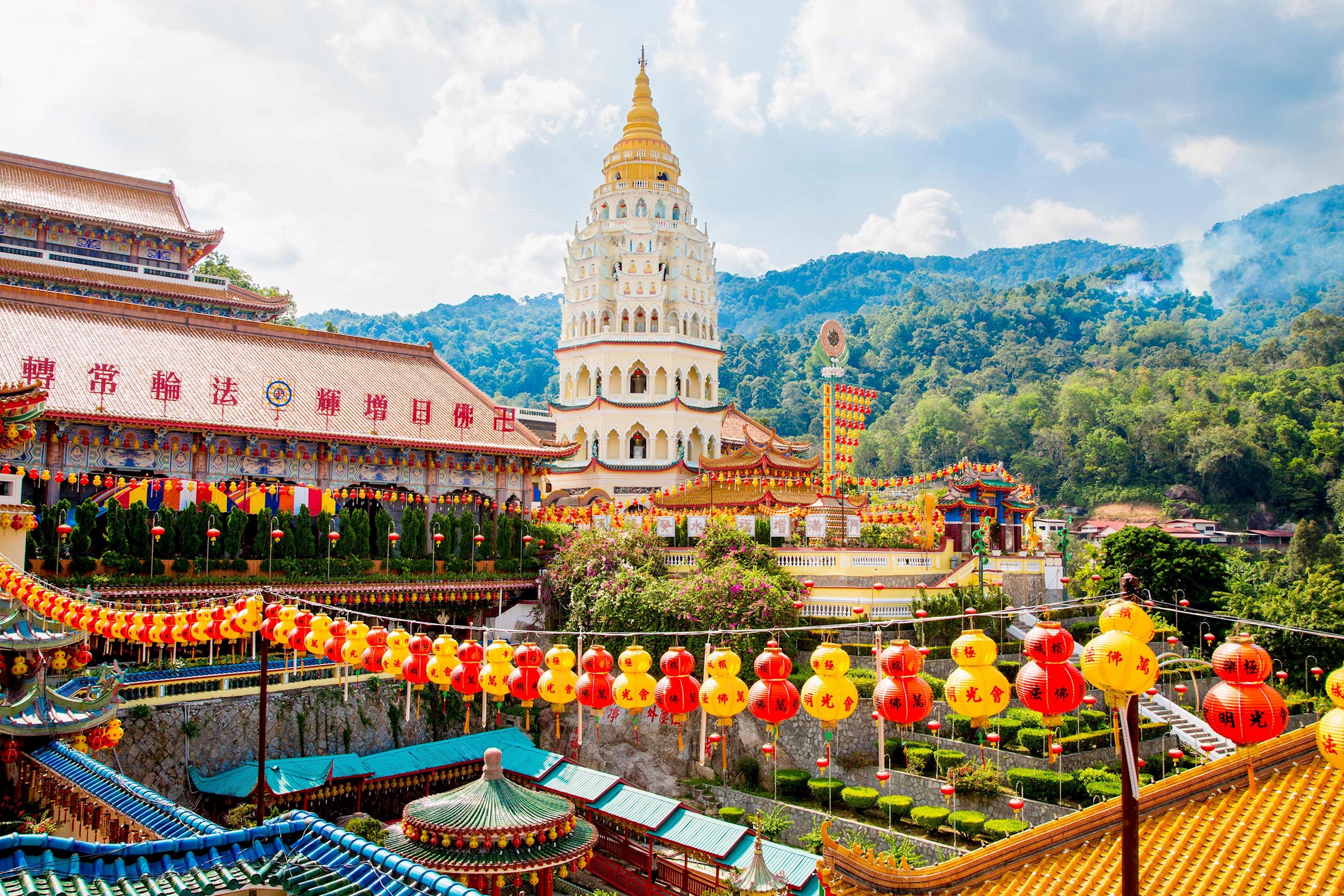 Panoramic view of Kek Lok Si Temple with red and yellow lanterns in Penang, Malaysia