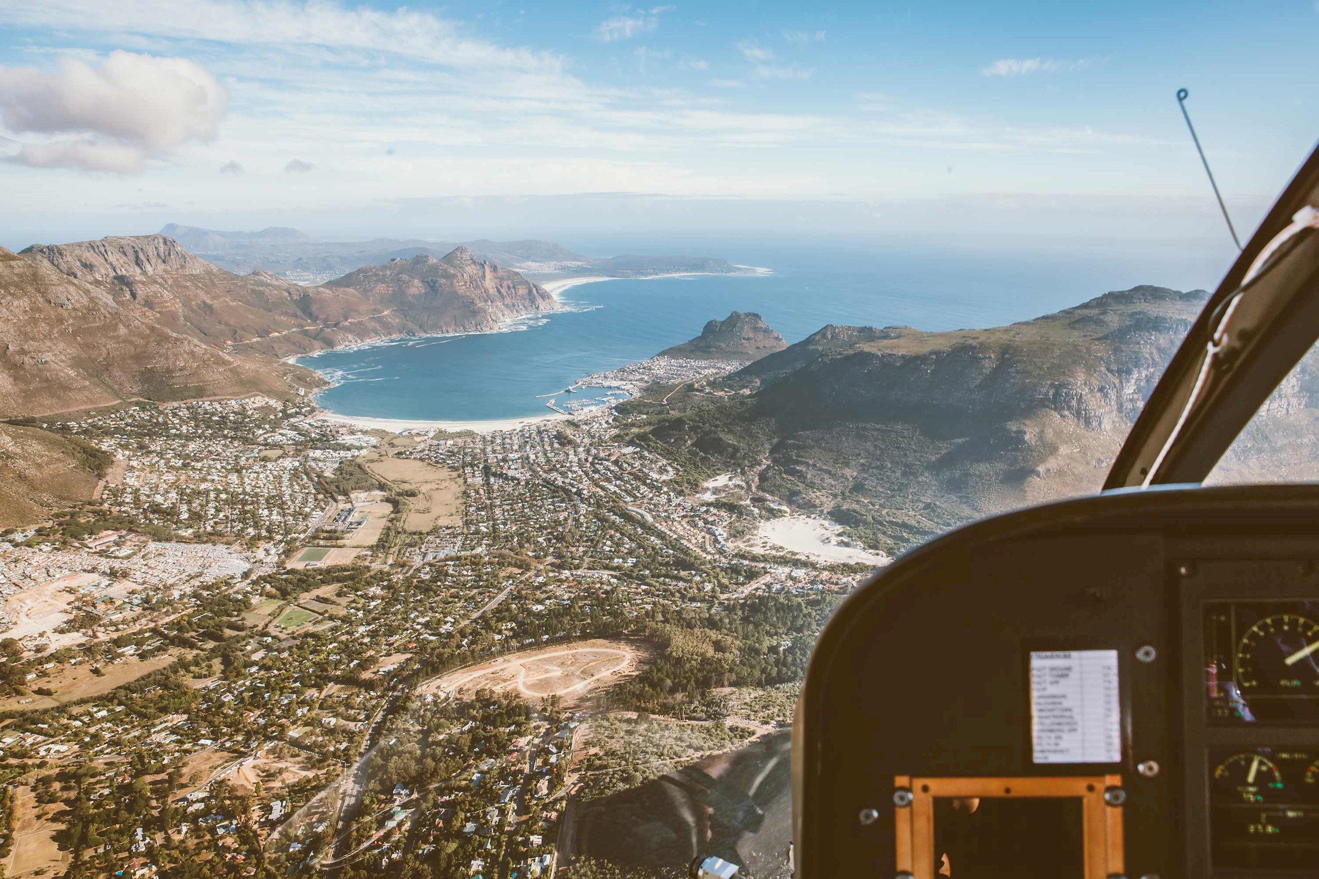 Helicopter cabin view over Cape Town coastline, South Africa