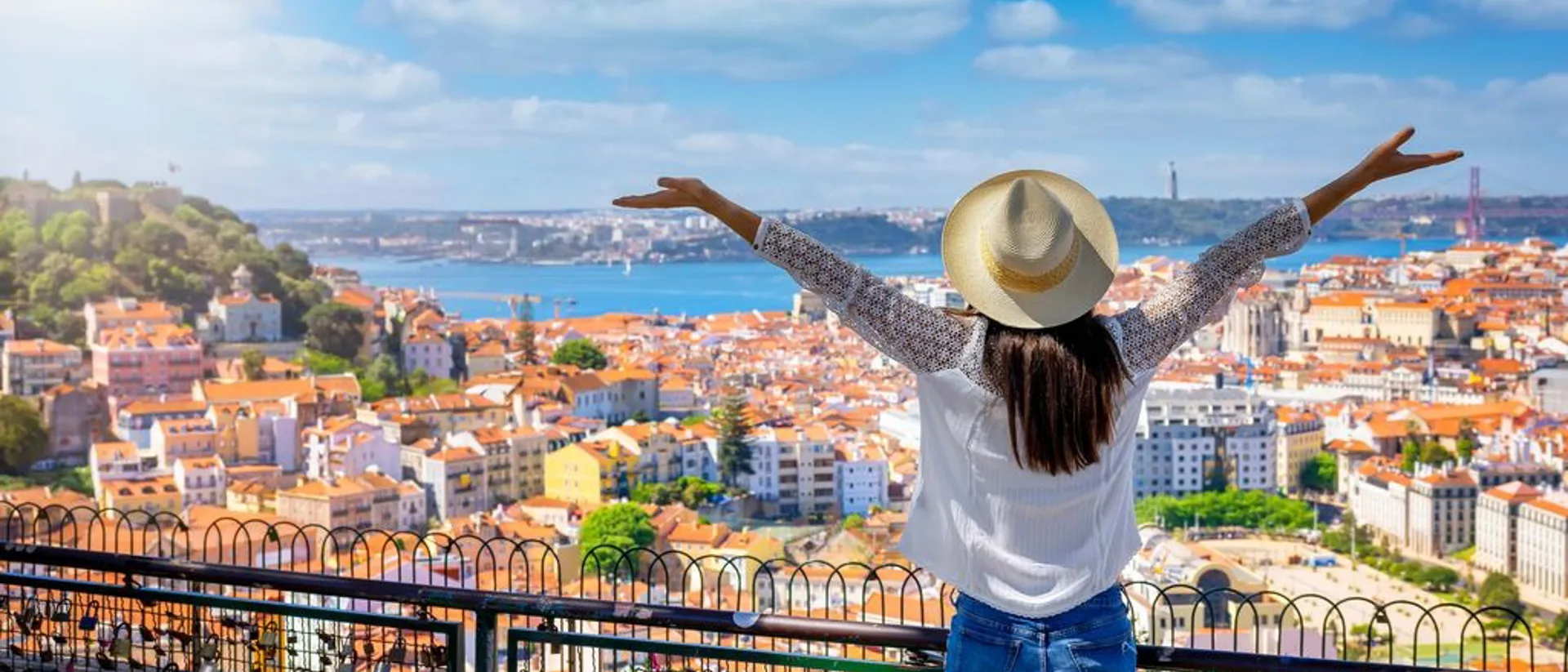 a-happy-tourist-woman-overlooks-the-colorful-old-town-alfama-of-lisbon-city.jpg