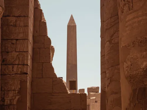 A tall pointed monument built in sandstone, part of a museum in Cairo, Egypt.