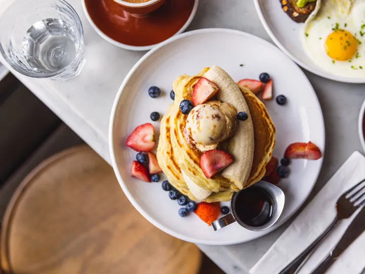 Pancakes With Banana, Strawberry And Blueberry Served In A Cafe For Breakfast
