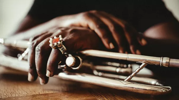 Close-up on the hands of the person playing the trumpet in Museum Of African American Music Nashville Usa