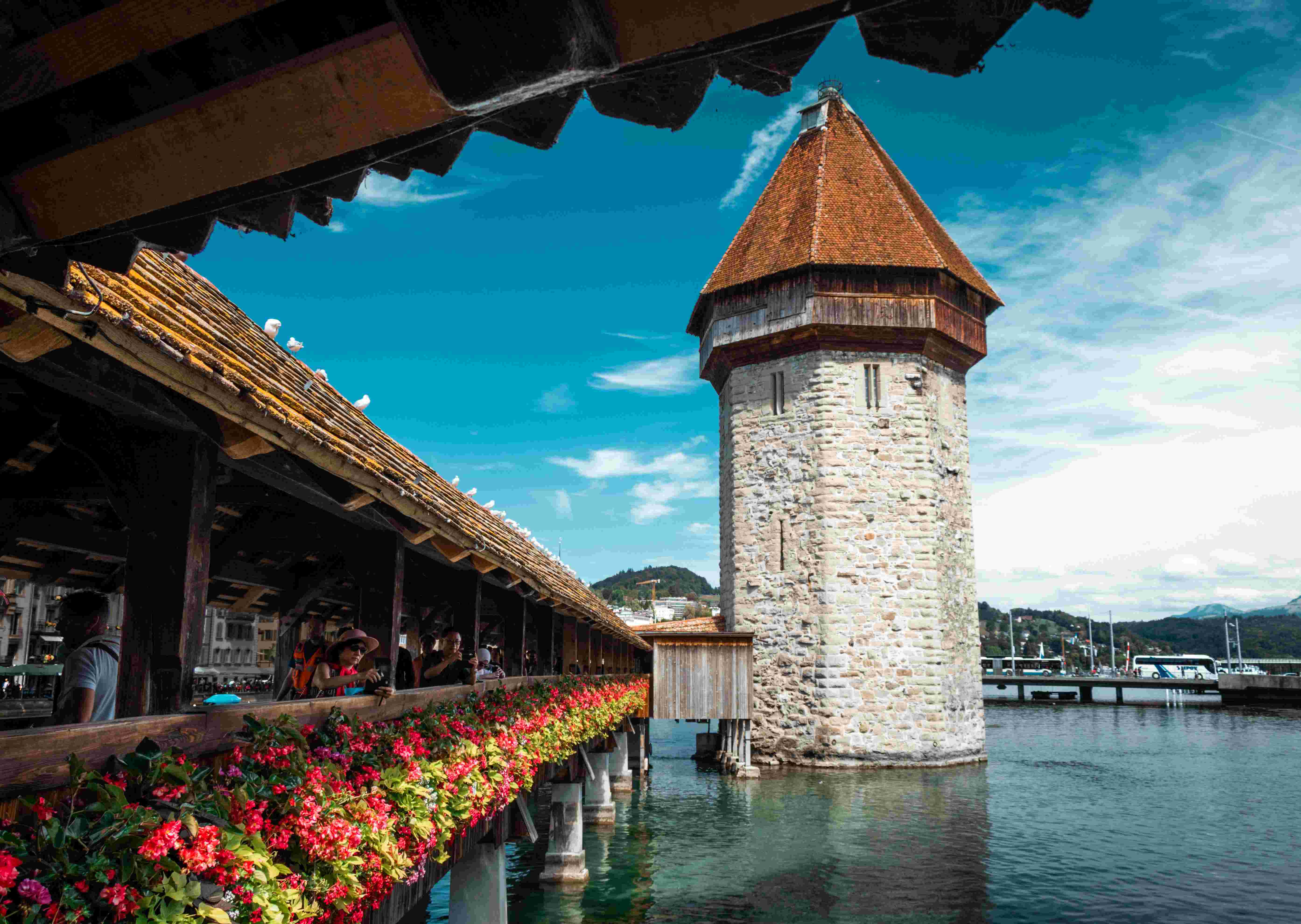 Wooden Bridge in Lucerne, Switzerland, with flowers running along the outside