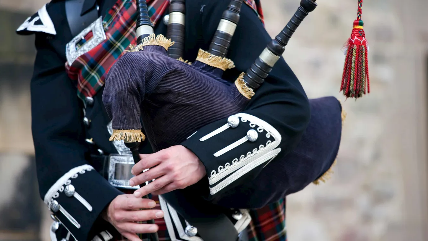 Man playing Bagpipes in Edinburgh, Scotland