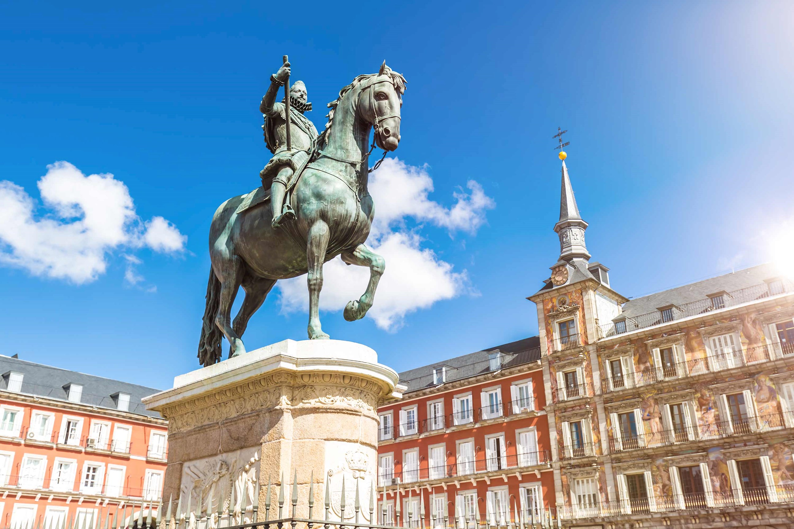Close-up of a statue in plaza with buildings in Madrid, Spain