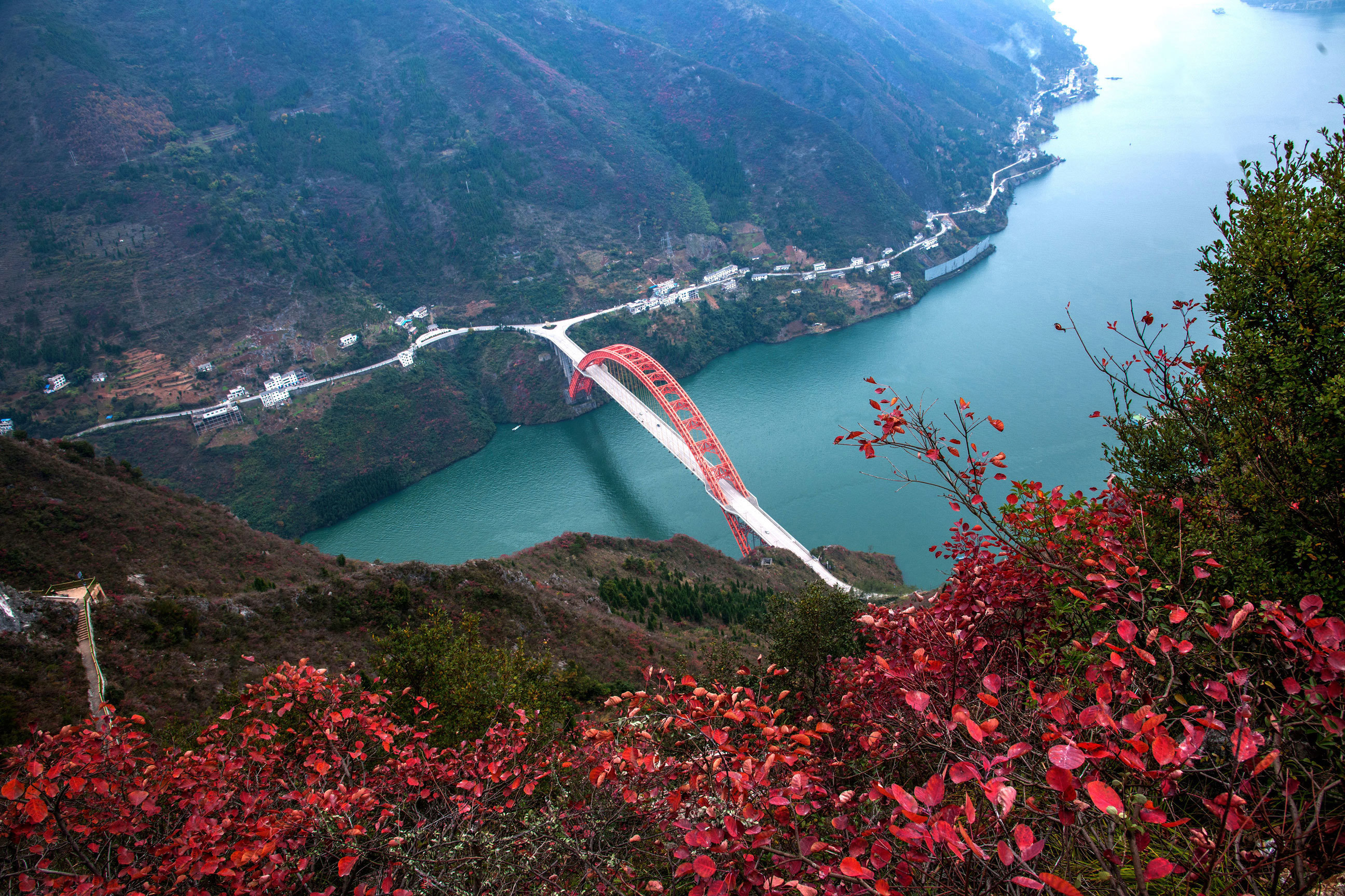 Scenic view of red bridge and fall foliage on Yangtze River, China