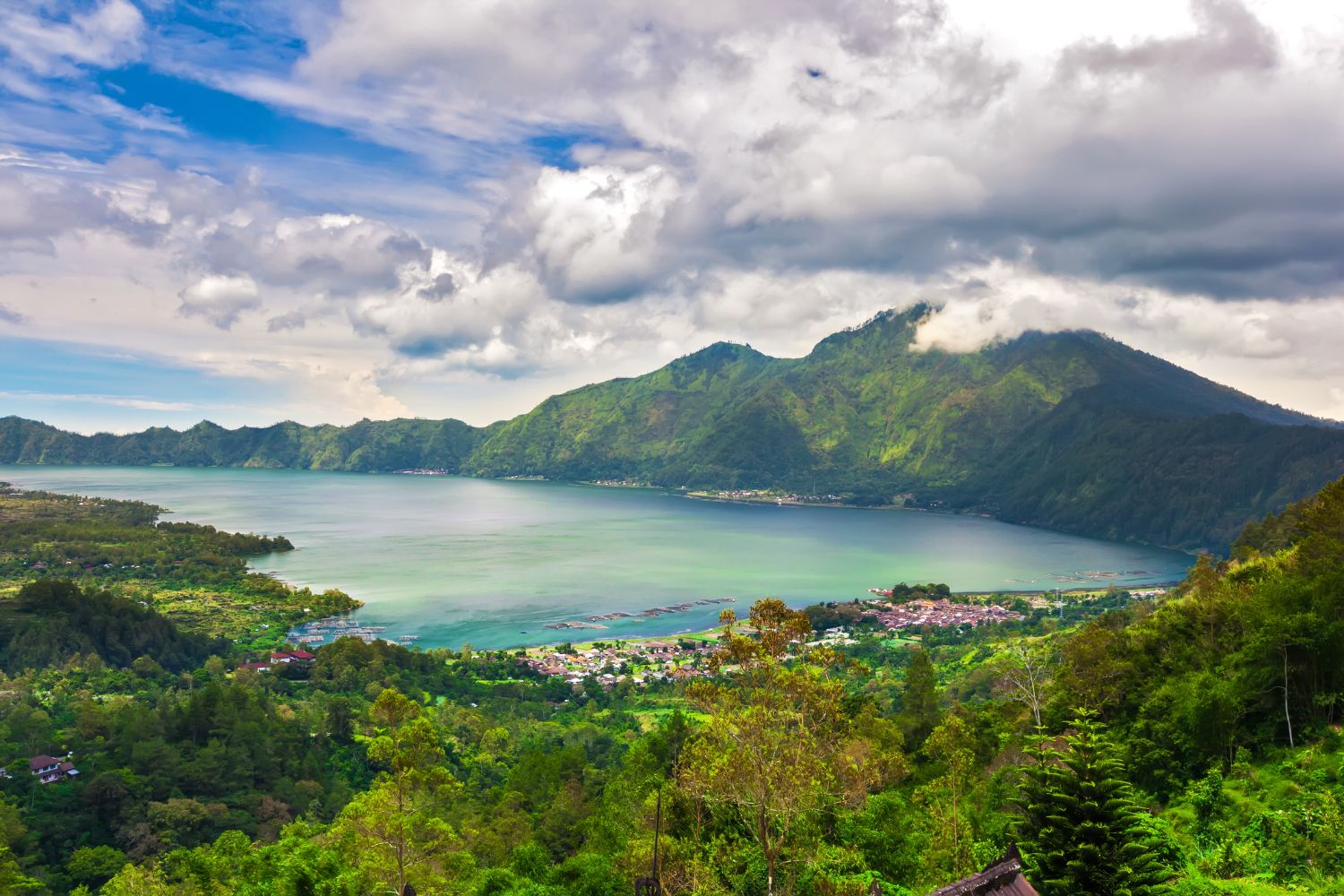 Beautiful scene of Lake Batur Bali Indonesia, surrounded by lush green mountains