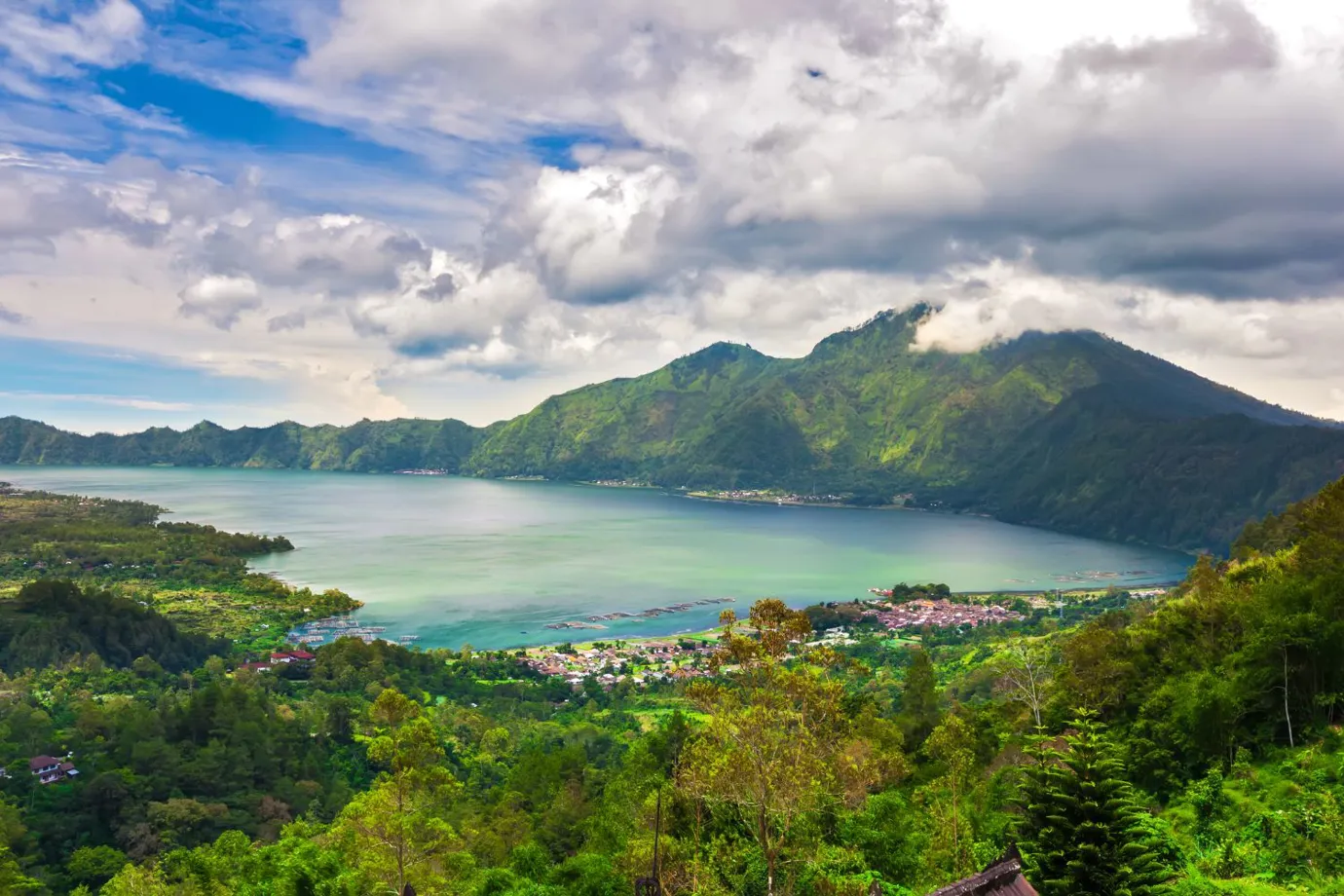 Beautiful scene of Lake Batur Bali Indonesia, surrounded by lush green mountains