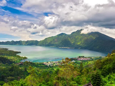 Beautiful scene of Lake Batur Bali Indonesia, surrounded by lush green mountains