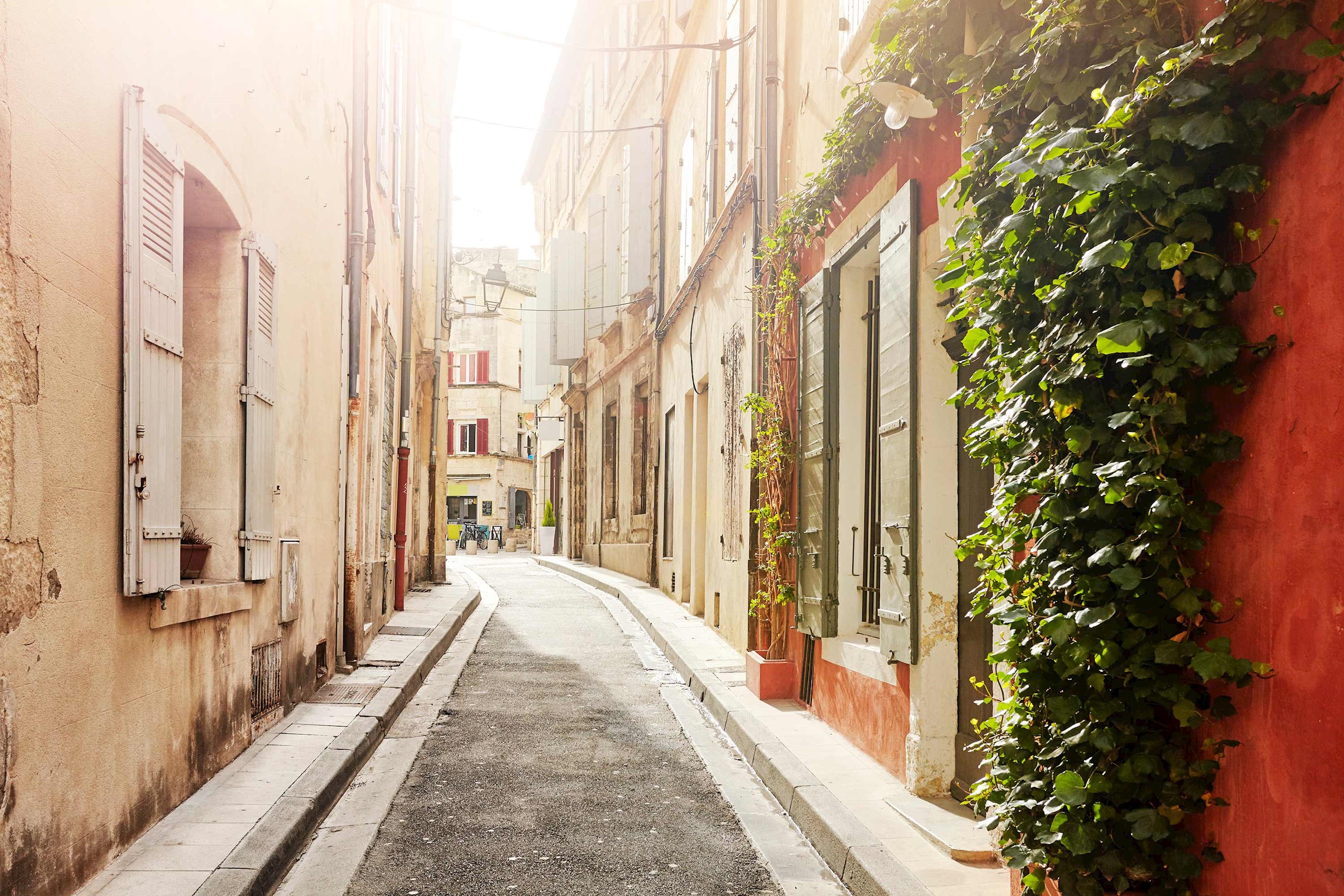 Close view of narrow cobblestone street in Arles, France