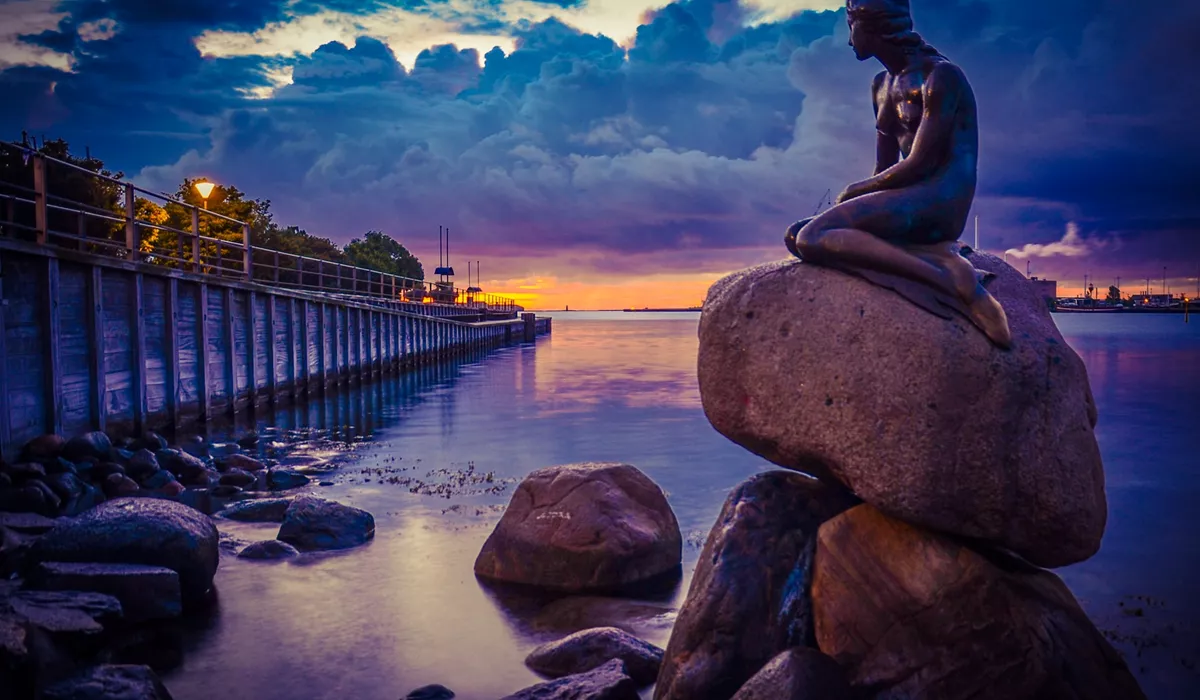 Scandinavia Copenhagen Little Mermaid Monument at sunset