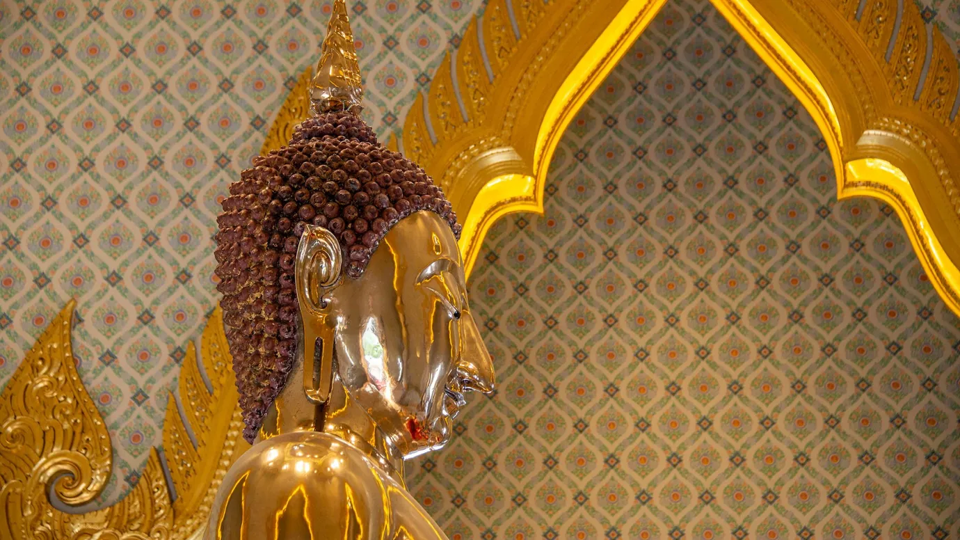 Close-up of Golden Buddha statue at Wat Traimit Temple in Bangkok, Thailand