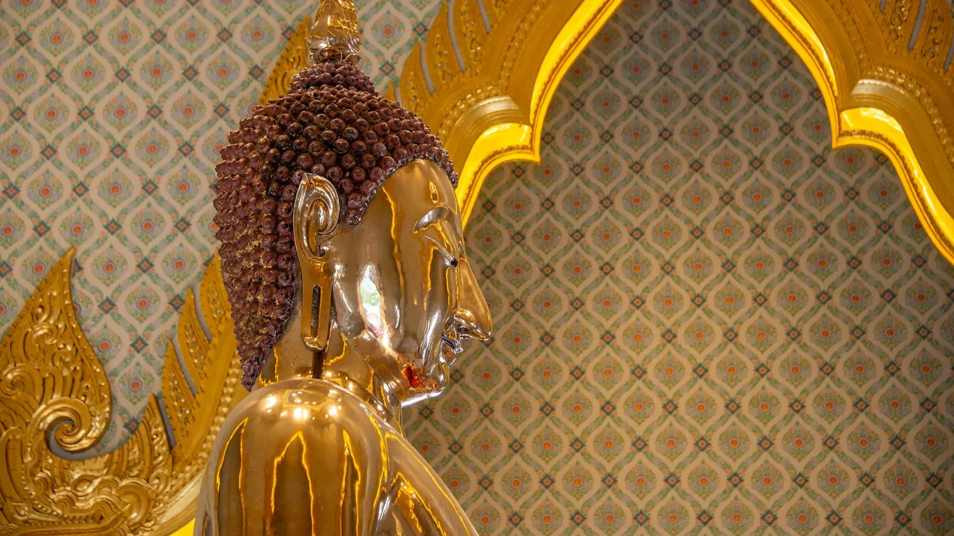 Close-up of Golden Buddha statue at Wat Traimit Temple in Bangkok, Thailand