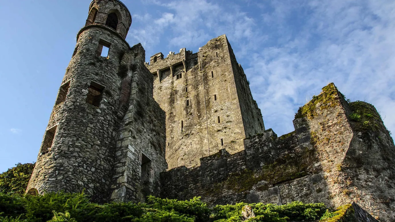 A low angle shot of Blarney Castle against clear skies in Cork, Ireland