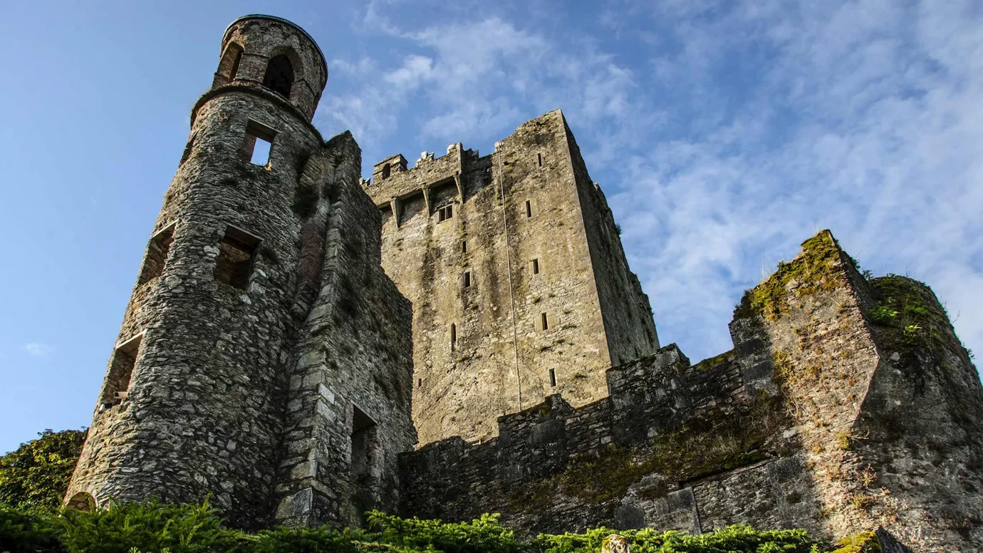 A low angle shot of Blarney Castle against clear skies in Cork, Ireland