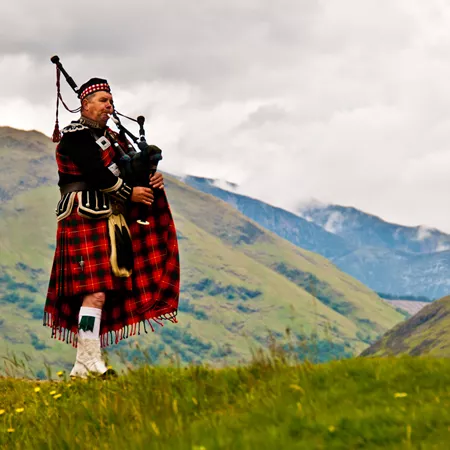 Highland Bagpiper In Kilt in Scotland