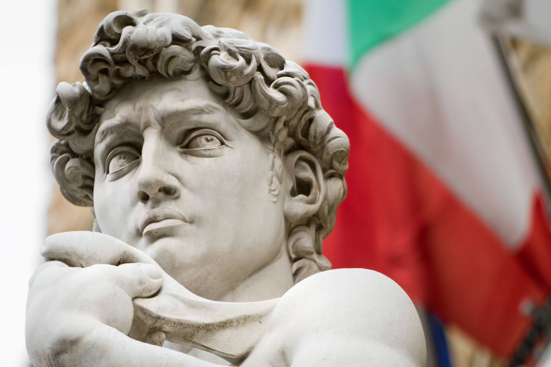 David Of Michelangelo Sculpture In Florence With Italian Flag