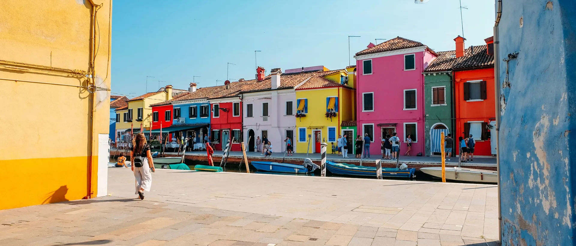 Woman walking in Murano in Venice, Italy